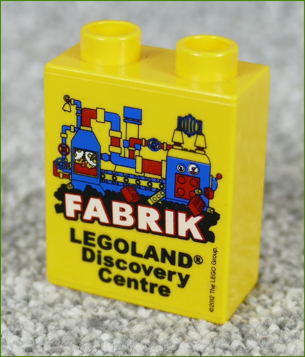 Lego® Duplo® Kostka 1x2x2 Žlutá - Fabrik Legoland 2012