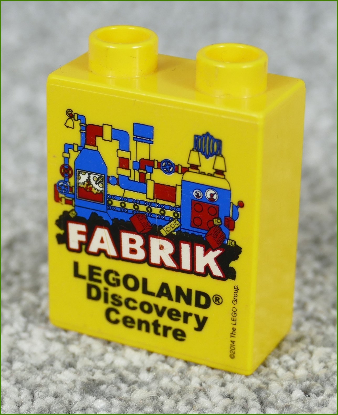 Lego® Duplo® Kostka 1x2x2 Žlutá - Fabrik Legoland 2014
