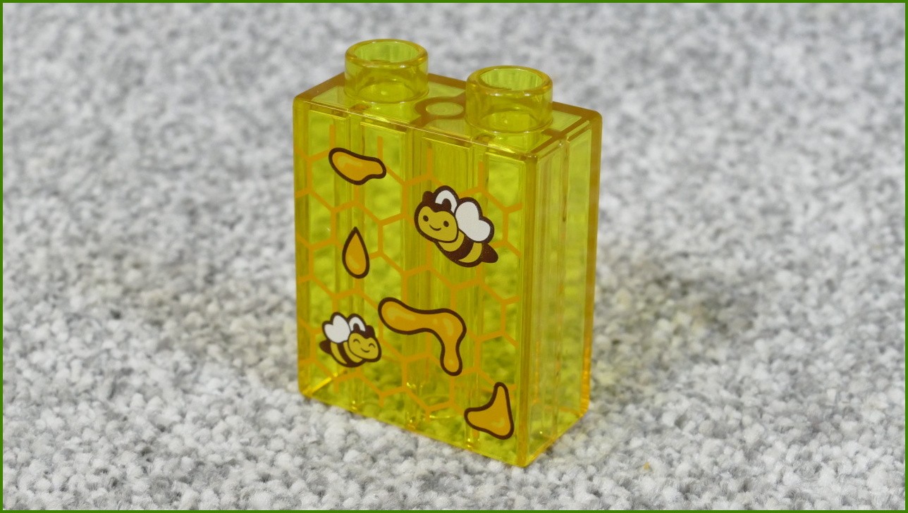 Lego® Duplo® Kostka 1x2x2 Průhledná Světle Oranžová s Potiskem Pláství a Včeliček - Nová