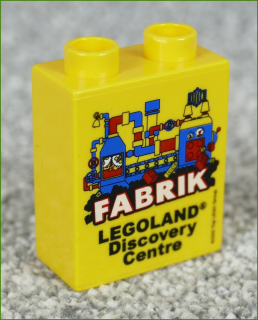 Lego® Duplo® Kostka 1x2x2 Žlutá - Fabrik Legoland 2012