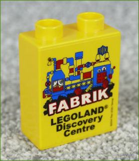 Lego® Duplo® Kostka 1x2x2 Žlutá - Fabrik Legoland 2014