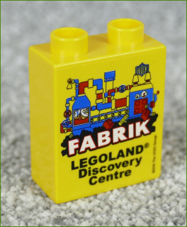 Lego® Duplo® Kostka 1x2x2 Žlutá - Fabrik Legoland 2015