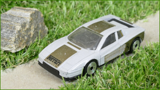 Autíčko Matchbox Ferrari Testarossa (Lasers)